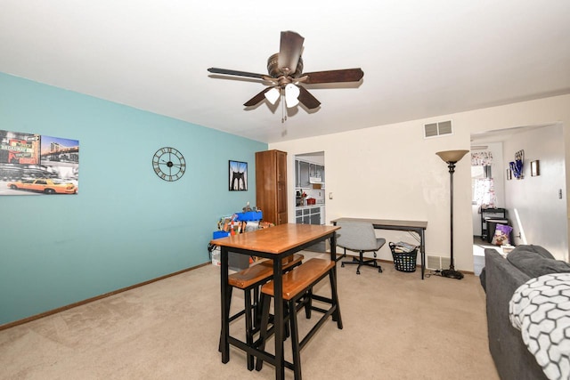 5640 Cambridge Ln Unit 5, Mount Pleasant, WI 53406 - dining space with light colored carpet and a ceiling fan