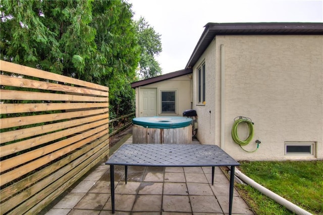 1418 Keith St, Eau Claire, WI 54701 - view of patio / terrace with a hot tub