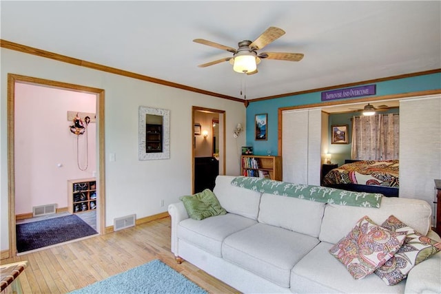 1418 Keith St, Eau Claire, WI 54701 - living room with a ceiling fan, wood finished floors, and crown molding