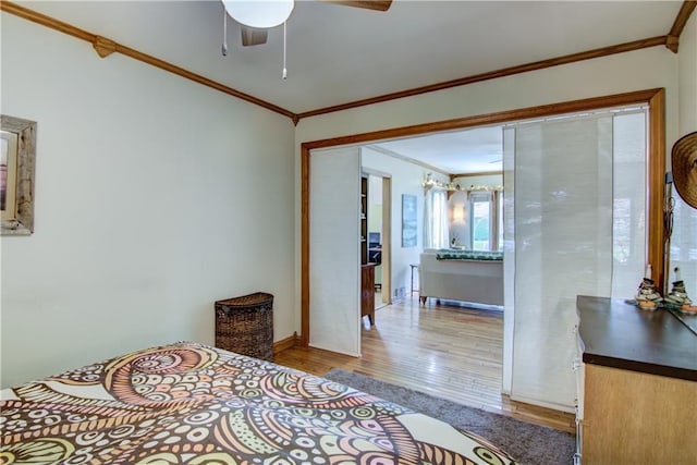 1418 Keith St, Eau Claire, WI 54701 - bedroom featuring crown molding, wood finished floors, and a ceiling fan
