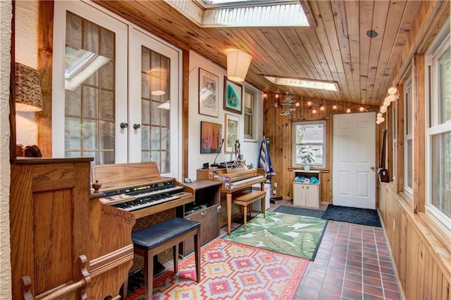1418 Keith St, Eau Claire, WI 54701 - sitting room with a skylight, french doors, wood ceiling, tile patterned floors, and vaulted ceiling