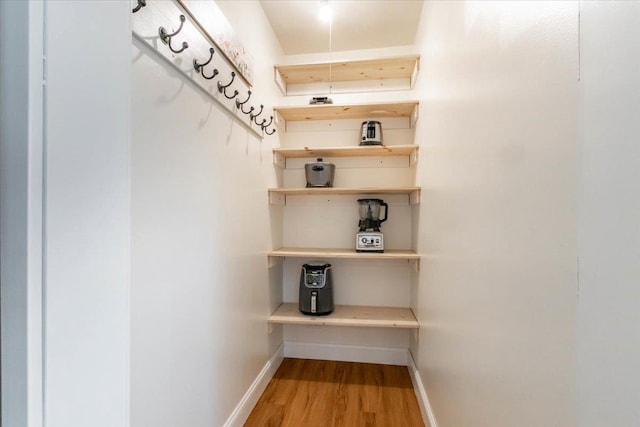 117 6th St, Nekoosa, WI 54457 - spacious closet featuring wood finished floors