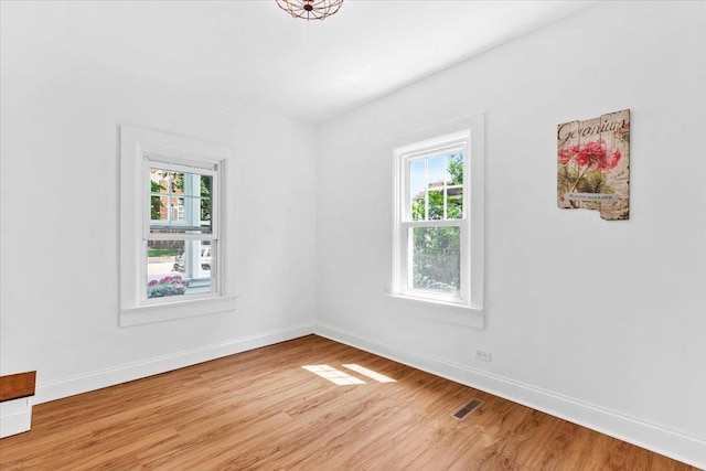 117 6th St, Nekoosa, WI 54457 - spare room featuring light wood-type flooring and baseboards