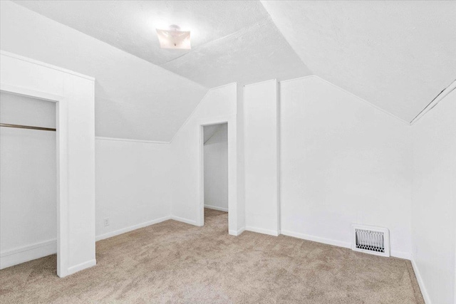 117 6th St, Nekoosa, WI 54457 - bonus room featuring carpet flooring and vaulted ceiling