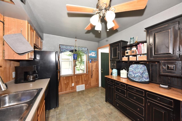 819 S 90th St, West Allis, WI 53214 - kitchen with ceiling fan, light countertops, wood walls, and open shelves