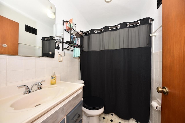 819 S 90th St, West Allis, WI 53214 - bathroom featuring vanity, a shower with shower curtain, and tile walls