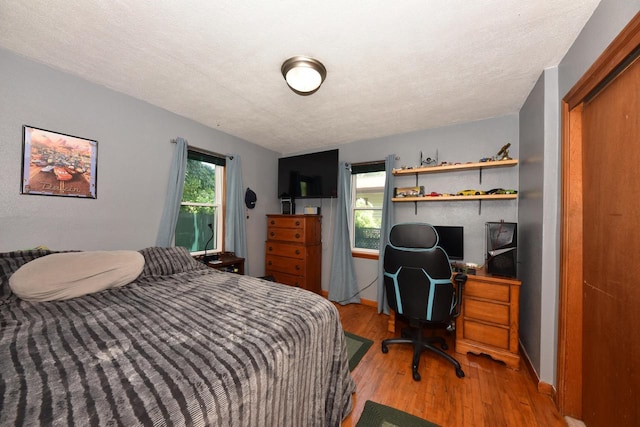 819 S 90th St, West Allis, WI 53214 - bedroom featuring light wood-style flooring and an office area