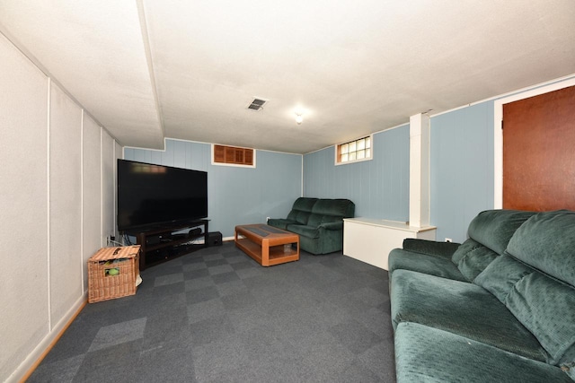 819 S 90th St, West Allis, WI 53214 - living area with dark colored carpet and a decorative wall