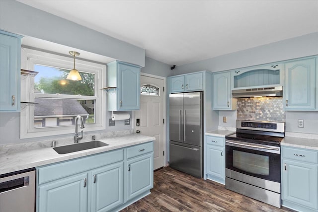 1716 Michael Dr, Waukesha, WI 53189 - kitchen featuring stainless steel appliances, under cabinet range hood, plenty of natural light, and blue cabinetry