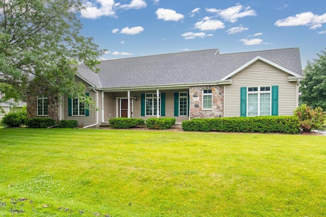 4431 Bellhaven Ln, Oshkosh, WI 54904 - view of front facade with covered porch, stone siding, a front yard, and a shingled roof