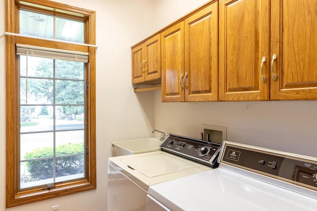 4431 Bellhaven Ln, Oshkosh, WI 54904 - washroom featuring cabinet space and washing machine and dryer