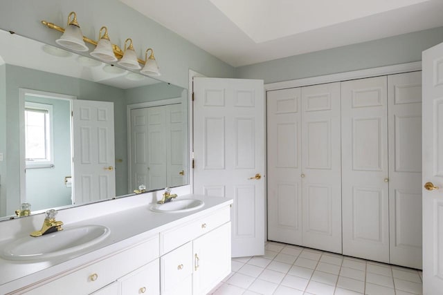 4431 Bellhaven Ln, Oshkosh, WI 54904 - full bathroom with a closet, double vanity, and tile patterned flooring