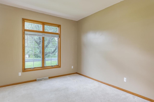 4431 Bellhaven Ln, Oshkosh, WI 54904 - empty room featuring healthy amount of natural light and light colored carpet