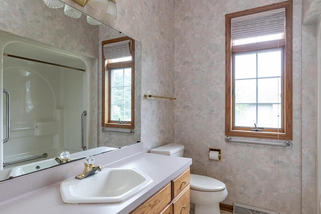 4431 Bellhaven Ln, Oshkosh, WI 54904 - full bathroom featuring vanity, a shower, and wallpapered walls