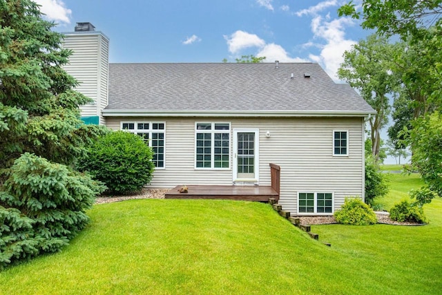 4431 Bellhaven Ln, Oshkosh, WI 54904 - back of property featuring a chimney, a lawn, roof with shingles, and a deck
