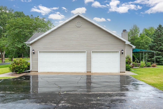 4431 Bellhaven Ln, Oshkosh, WI 54904 - garage with asphalt driveway