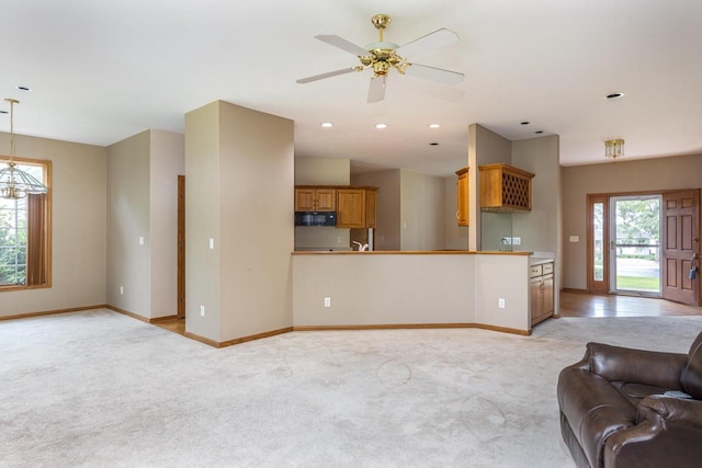 4431 Bellhaven Ln, Oshkosh, WI 54904 - unfurnished living room with light colored carpet, a ceiling fan, and recessed lighting