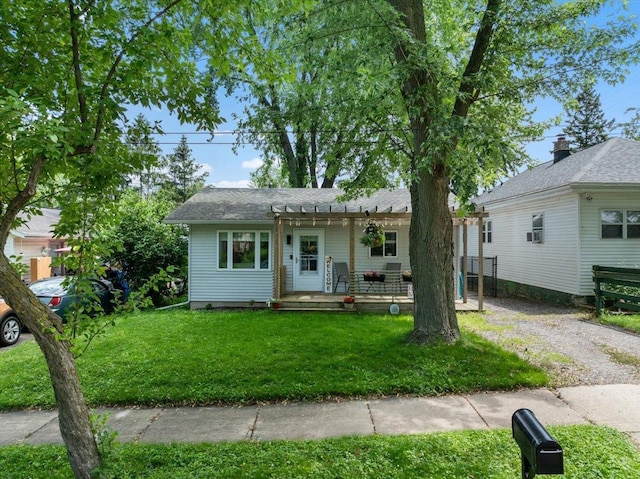 203 N Vine St, Marshfield, WI 54449 - view of front of property with a front yard, a porch, and gravel driveway