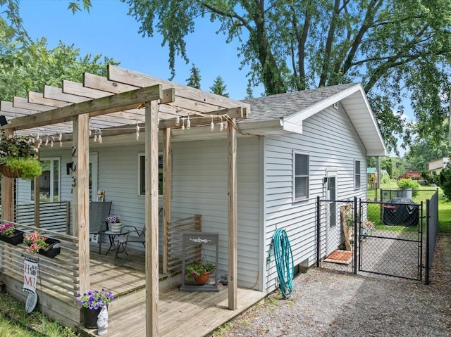 203 N Vine St, Marshfield, WI 54449 - view of property exterior featuring a gate, a pergola, roof with shingles, and covered porch