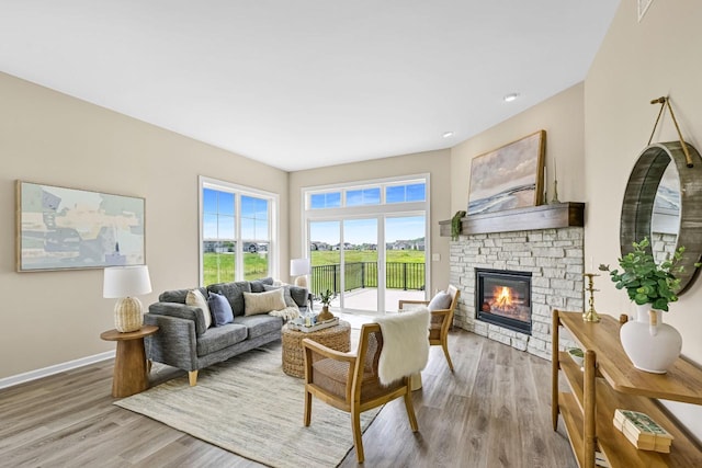 1382 Prairie Creek Cir Unit 15D, Oconomowoc, WI 53066 - living area featuring light wood-style floors, a fireplace, and recessed lighting
