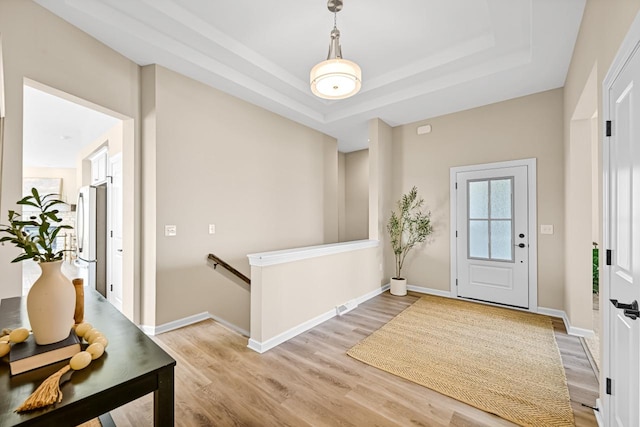 1382 Prairie Creek Cir Unit 15D, Oconomowoc, WI 53066 - foyer with light wood-type flooring and a raised ceiling