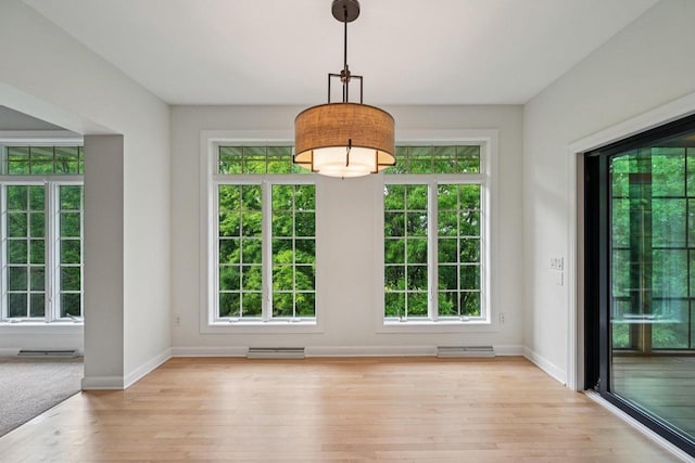 1706 Ashlawn Ln, Waunakee, WI 53597 - unfurnished dining area featuring healthy amount of natural light and light wood-style floors