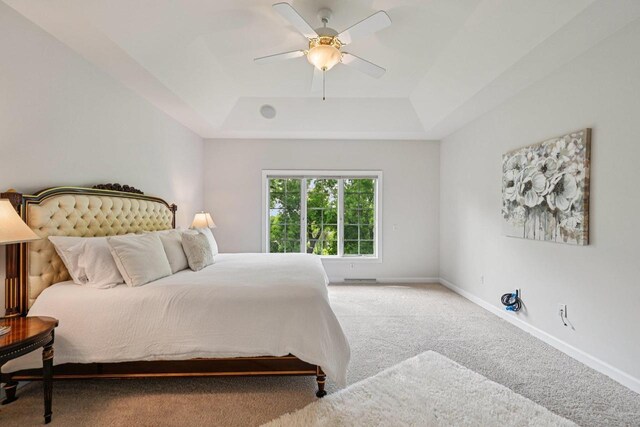 1706 Ashlawn Ln, Waunakee, WI 53597 - carpeted bedroom featuring a tray ceiling and ceiling fan