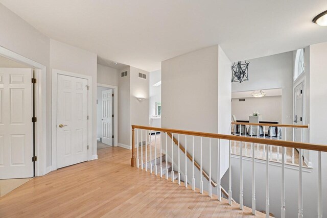 1706 Ashlawn Ln, Waunakee, WI 53597 - corridor with an upstairs landing and light wood finished floors