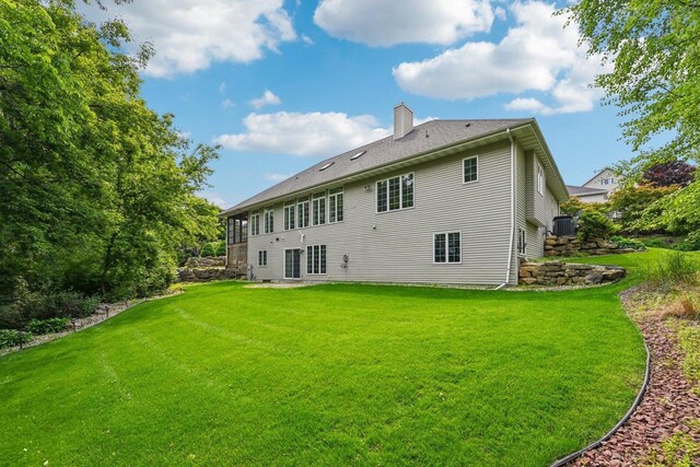 1706 Ashlawn Ln, Waunakee, WI 53597 - rear view of property with a chimney and a lawn