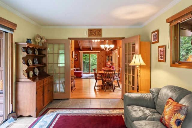 2831 N Wildwood Dr, Lake Geneva, WI 53147 - living area with a chandelier, tile patterned floors, and ornamental molding