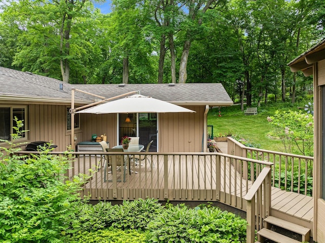 2831 N Wildwood Dr, Lake Geneva, WI 53147 - wooden terrace featuring outdoor dining area and view of wooded area