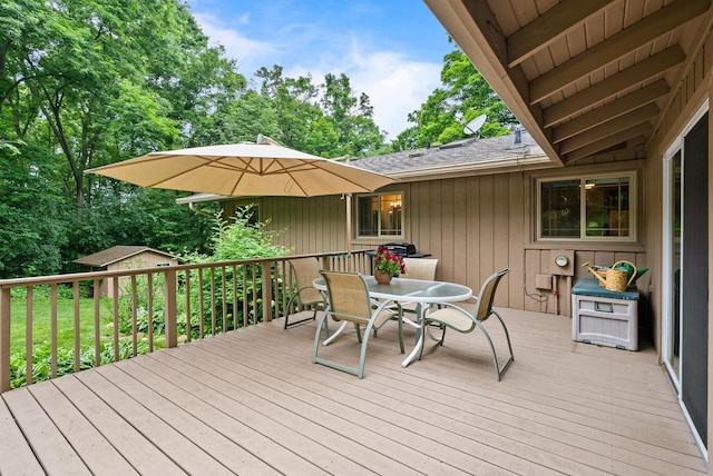 2831 N Wildwood Dr, Lake Geneva, WI 53147 - deck with outdoor dining area and an outbuilding