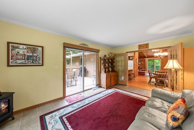 2831 N Wildwood Dr, Lake Geneva, WI 53147 - tiled living room featuring a wood stove, a chandelier, and ornamental molding