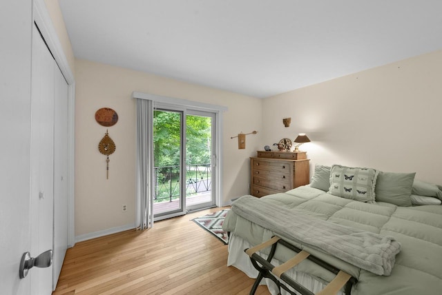 2831 N Wildwood Dr, Lake Geneva, WI 53147 - bedroom featuring access to exterior, light wood finished floors, and a closet
