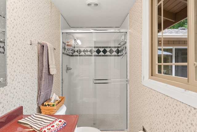 2831 N Wildwood Dr, Lake Geneva, WI 53147 - bathroom featuring a shower stall and wallpapered walls