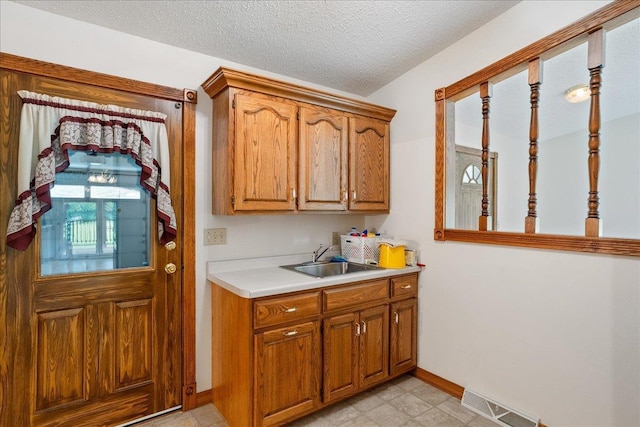 7269 County Road V, Marshfield, WI 54449 - laundry area featuring a textured ceiling and light floors