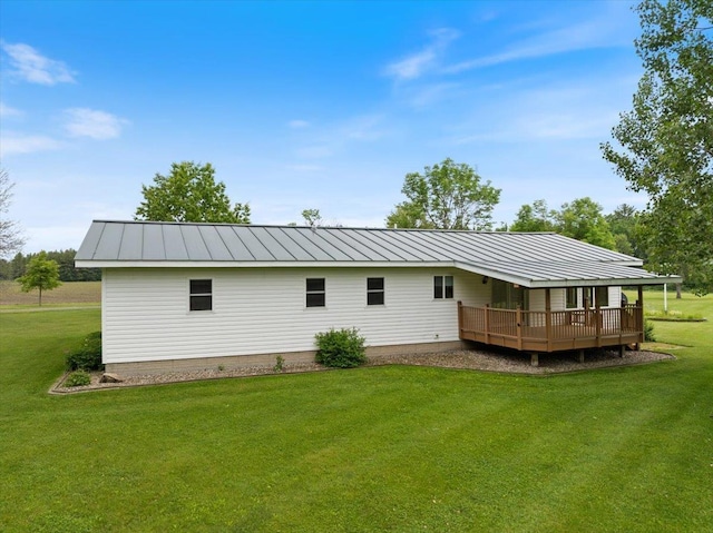7269 County Road V, Marshfield, WI 54449 - back of property featuring a lawn, a deck, and a metal roof