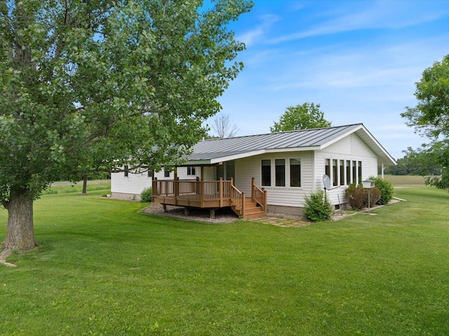 7269 County Road V, Marshfield, WI 54449 - back of house with crawl space, a yard, a deck, and a metal roof