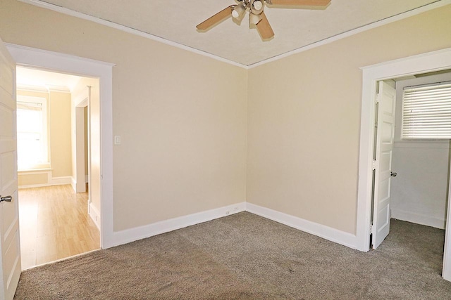 1416 Michigan Ave Unit 1416A, Sheboygan, WI 53081 - empty room with a ceiling fan, crown molding, and carpet floors