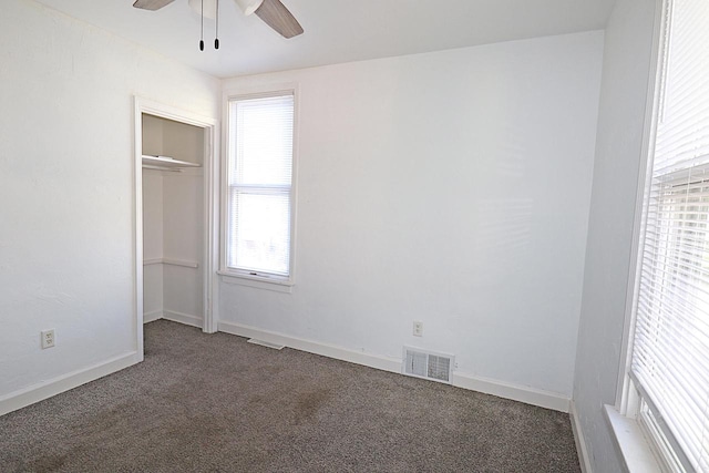 1416 Michigan Ave Unit 1416A, Sheboygan, WI 53081 - unfurnished bedroom featuring carpet, a closet, and a ceiling fan