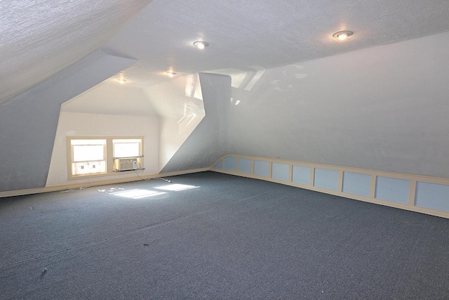 1416 Michigan Ave Unit 1416A, Sheboygan, WI 53081 - bonus room featuring carpet floors, a textured ceiling, cooling unit, and vaulted ceiling