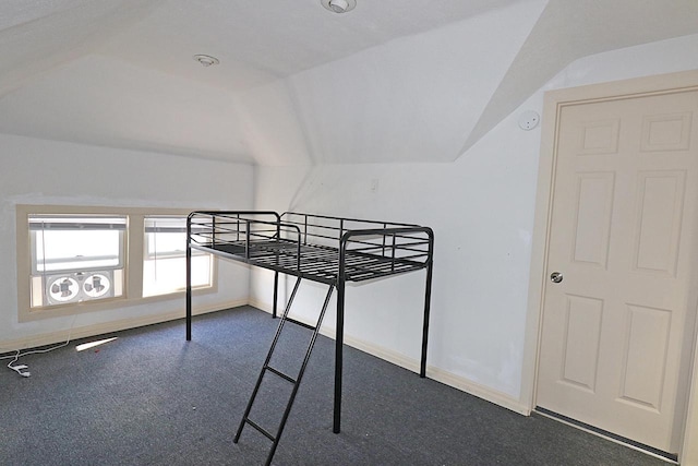 1416 Michigan Ave Unit 1416A, Sheboygan, WI 53081 - unfurnished bedroom with lofted ceiling and dark carpet