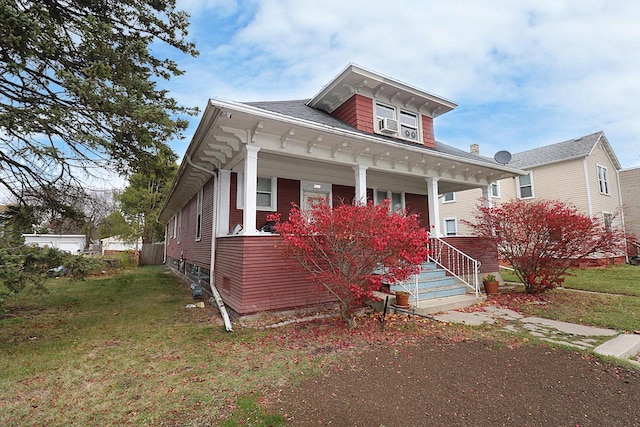 1416 Michigan Ave Unit 1416A, Sheboygan, WI 53081 - view of front facade featuring a porch and a front lawn