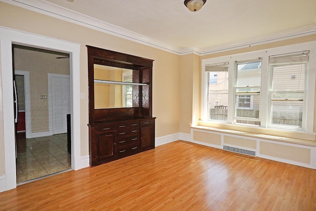 1416 Michigan Ave Unit 1416A, Sheboygan, WI 53081 - spare room with light wood-style floors and ornamental molding