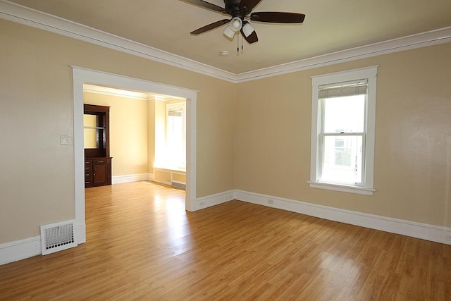 1416 Michigan Ave Unit 1416A, Sheboygan, WI 53081 - unfurnished room featuring ornamental molding, light wood-style floors, and a ceiling fan
