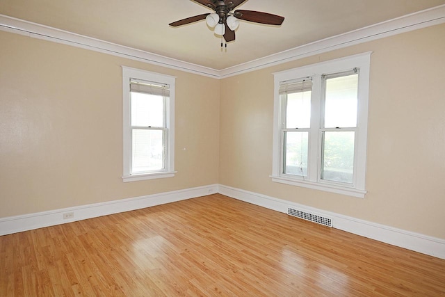 1416 Michigan Ave Unit 1416A, Sheboygan, WI 53081 - spare room featuring crown molding, wood finished floors, and a ceiling fan