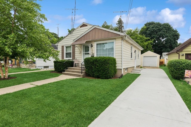 6109 38th Ave, Kenosha, WI 53142 - bungalow-style home with a detached garage, a front lawn, an outdoor structure, and board and batten siding