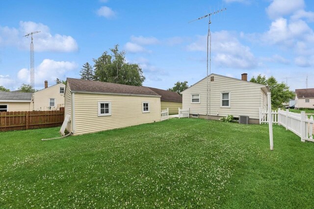 6109 38th Ave, Kenosha, WI 53142 - rear view of property featuring a fenced backyard