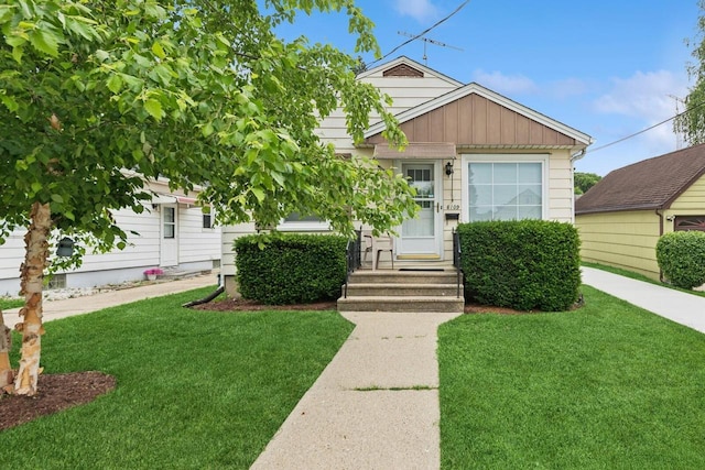 6109 38th Ave, Kenosha, WI 53142 - view of front of property featuring a front lawn and board and batten siding