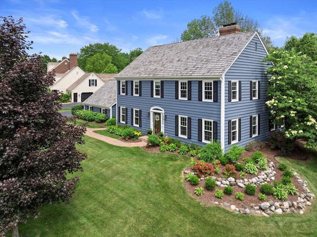 9848 N Lamplighter Ln, Mequon, WI 53092 - colonial inspired home featuring a chimney and a front yard
